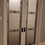 Custom antique brass interior door trim details. Glass centers. White lacquer frames. All hand made By: RBL Metals - Woodwork for this job - New Day Woodwork