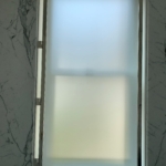 Custom polished nickel and etched glass bathroom window details - All hand made. Hand made By RRL Metals.