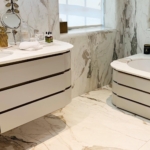 Custom light colored oil rub bronze (satin lacquer) in lays for a bathroom vanity. The satin lacquer and woodwork is by New Day Wood Work - RBL metals all metal fabrication for this project.