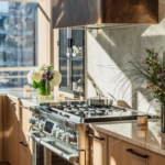 Custom curved antique brass kitchen hood. Satin lacquer coat. All hand made. By RBL METALS