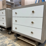 Custom curved oak bed side tables. Satin white lacquer drawer fronts and oil rubbed bronze legs with a bull nose detail Legs handmade RBL Metals